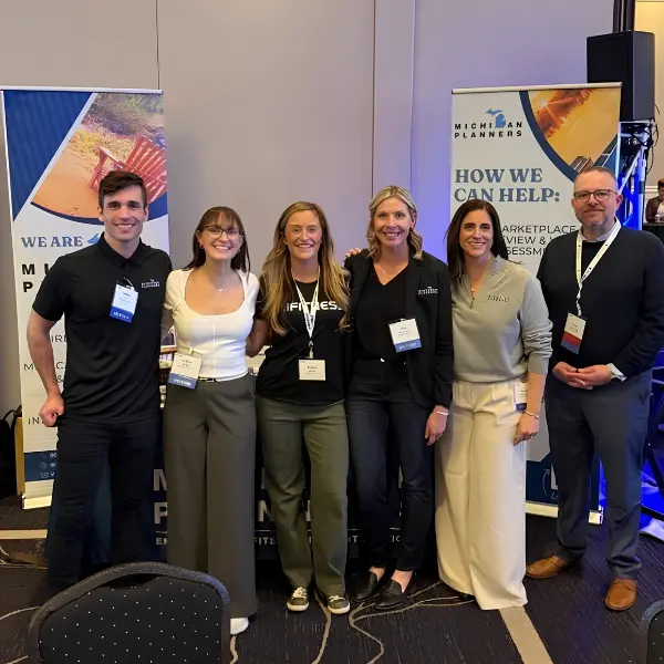 Members of the Michigan Planners team pose at an industry event.