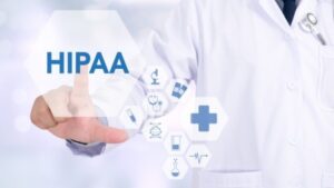 A doctor presses on a holographic button that reads, "HIPAA."