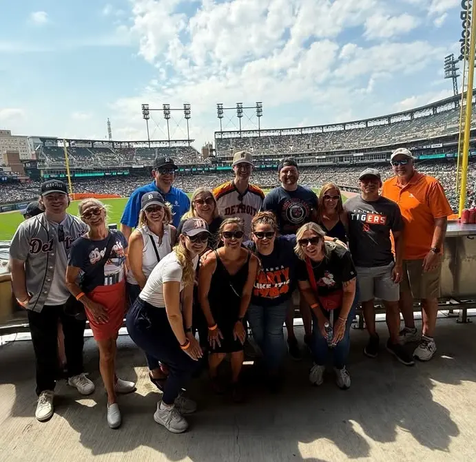 The Michigan Planners team poses at a Detroit Tigers game.