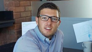 Michigan Planners' summer intern poses for a photo in the office.
