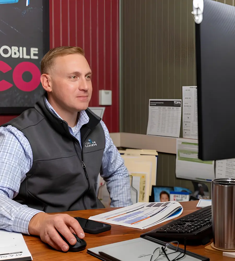 A Michigan Planners team member works at his computer.