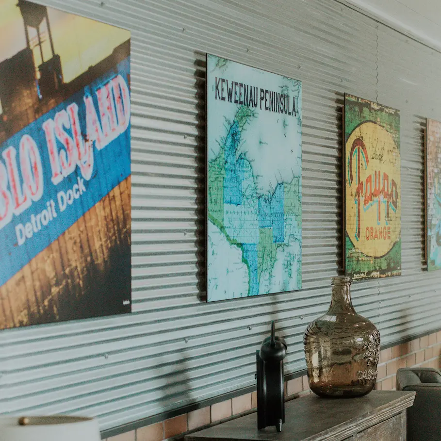 Several posters of Michigan cities line the walls of the Michigan Planners office.