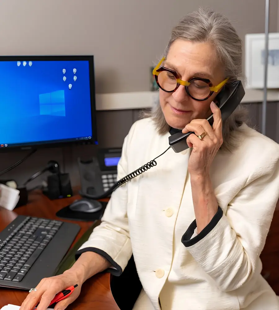 A senior talks on the phone.
