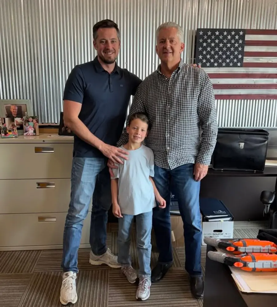 A Michigan Planners team member on the retirement team poses with his son and coworker.