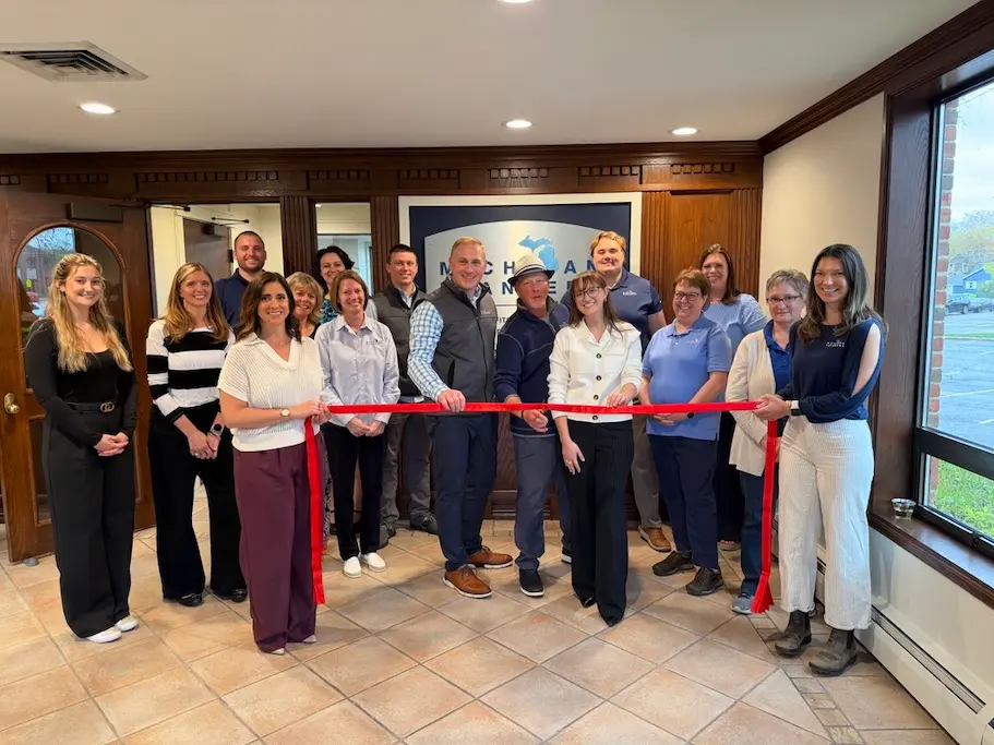The Michigan Planners Traverse City team poses at the grand opening celebration.